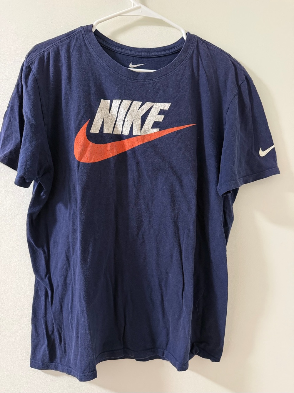 Nike Navy Short-Sleeve Tee with White Logo and Orange Swoosh